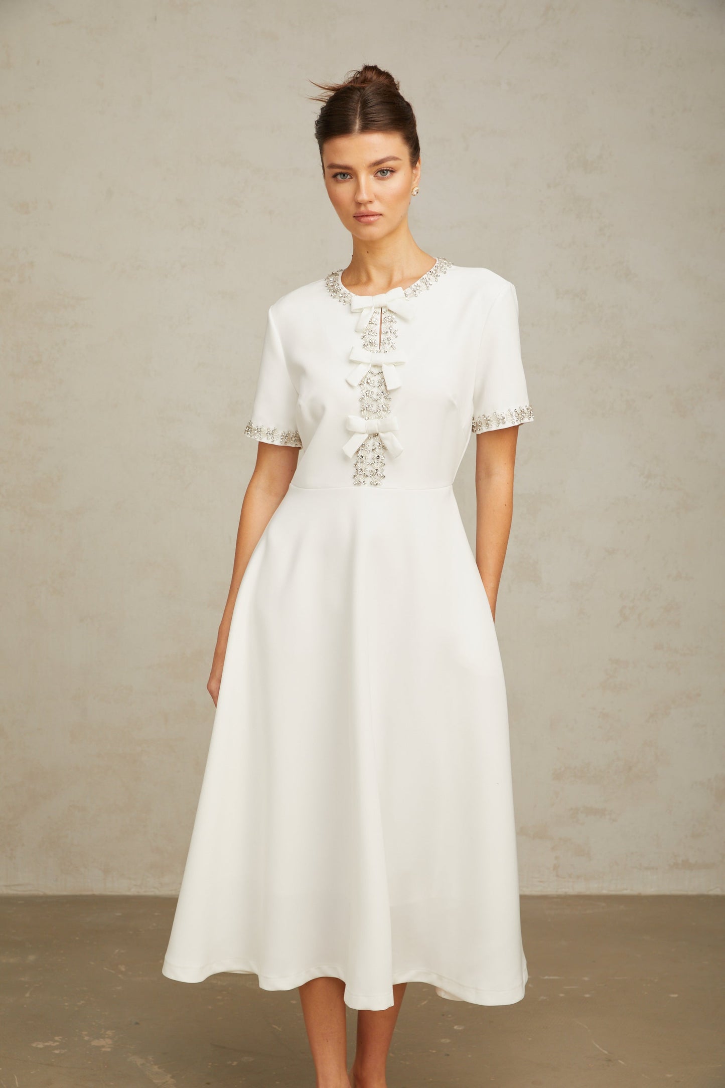 Cassiopeia crystal-accented bow midi dress in White