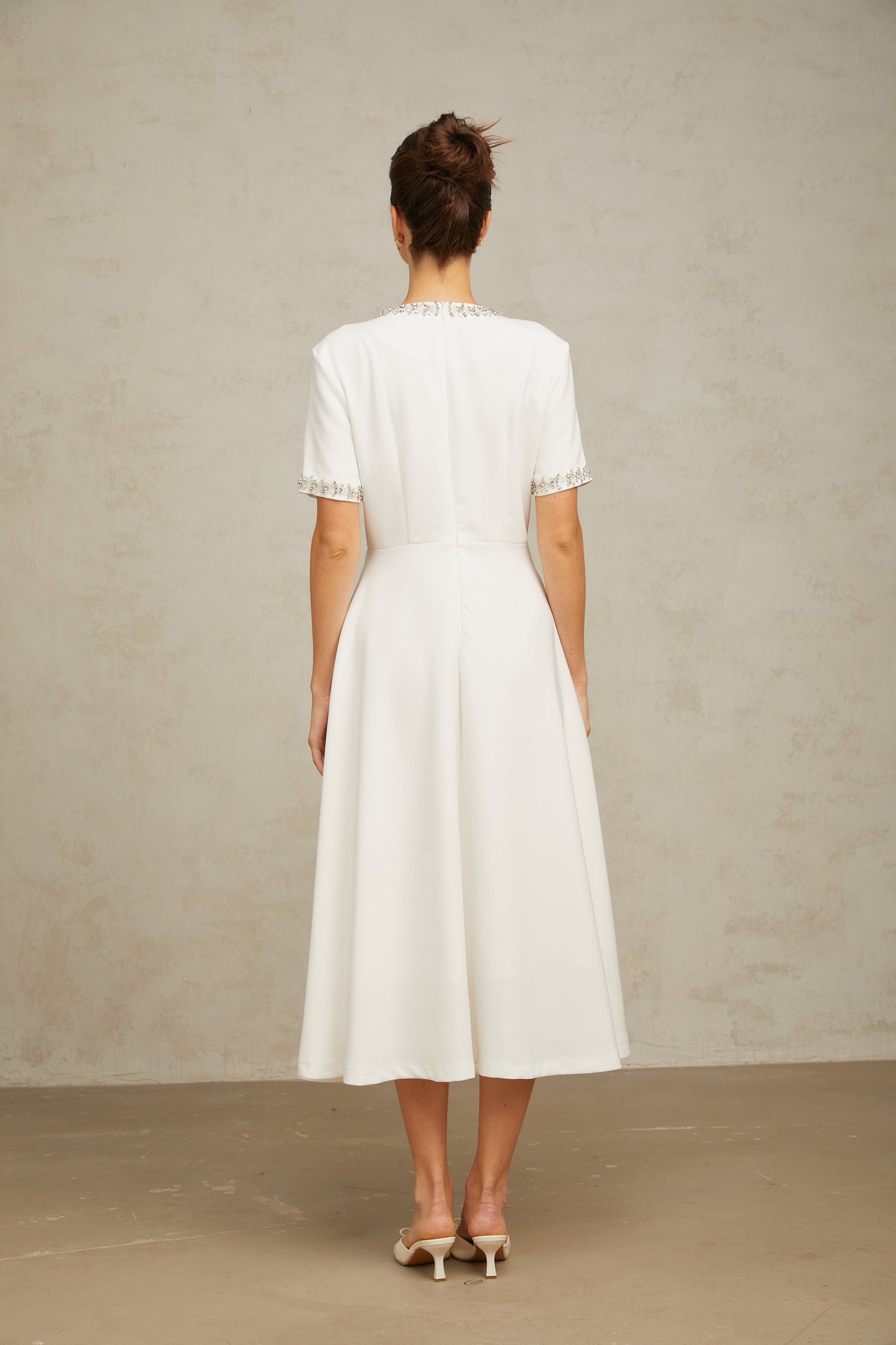 Cassiopeia crystal-accented bow midi dress in White
