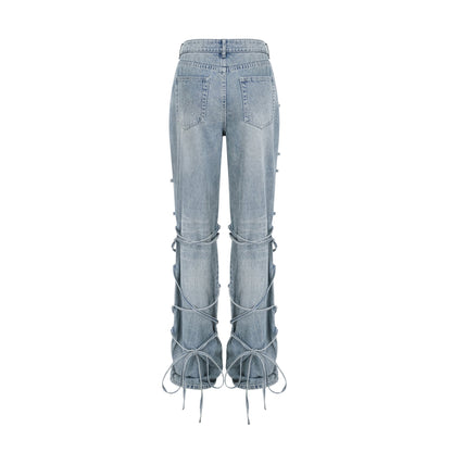 Géraldine strap-detail jeans