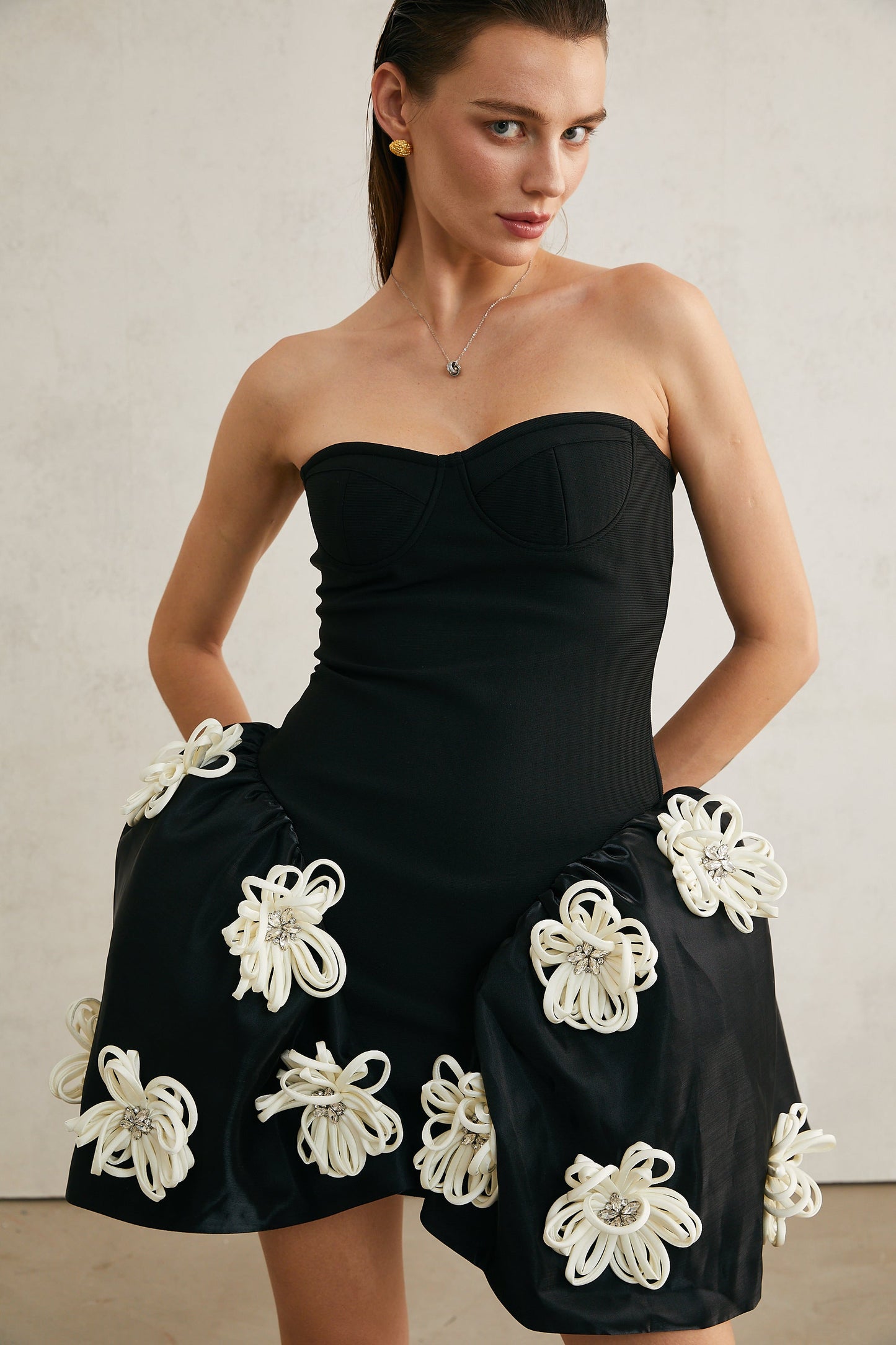 Léonor black floral-appliqué peplum mini dress