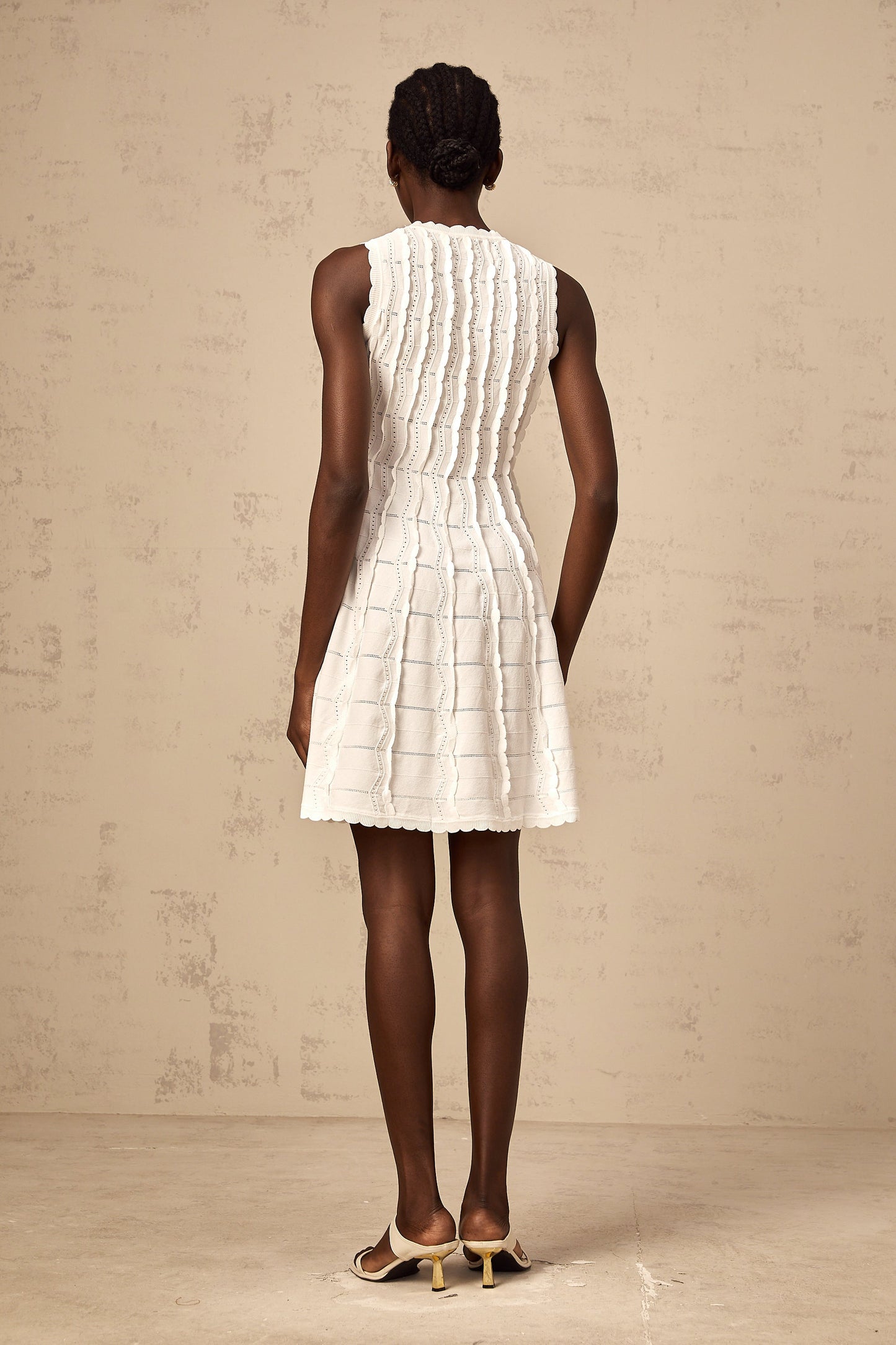 Esmée white ruffled sleeveless knit mini dress