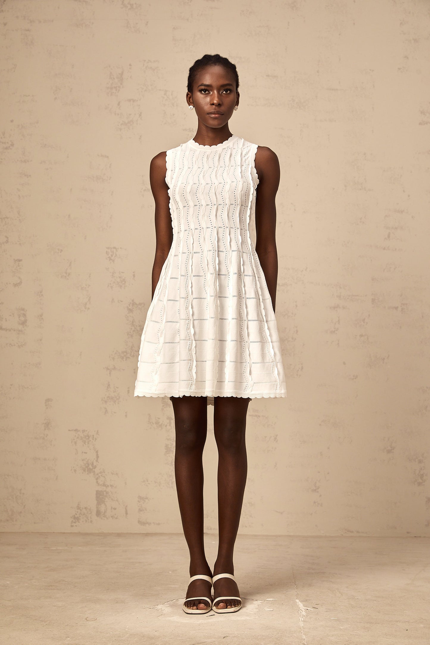 Esmée white ruffled sleeveless knit mini dress