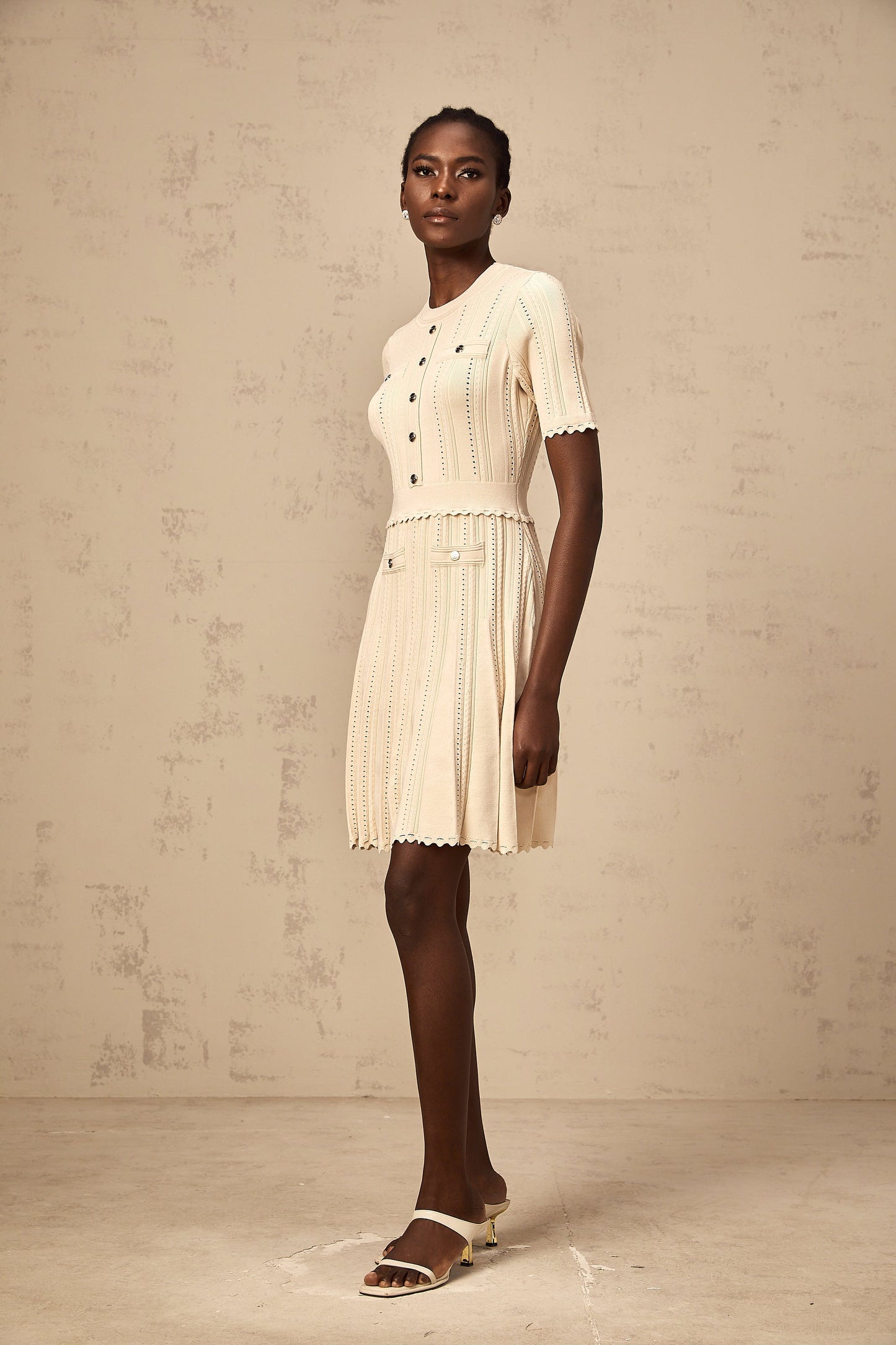 Amélie neutrals pointelle-trim pleated knit mini dress